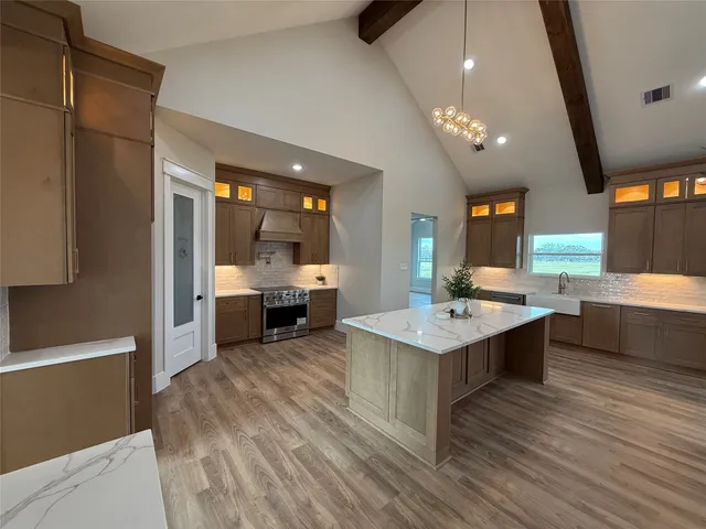 a kitchen with a sink and stove