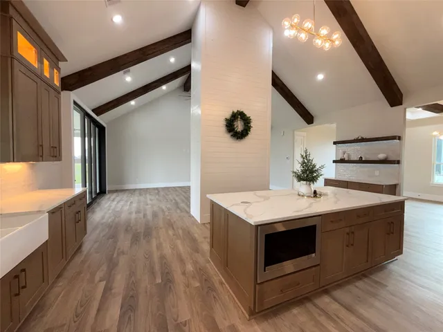a kitchen with a sink and cabinets