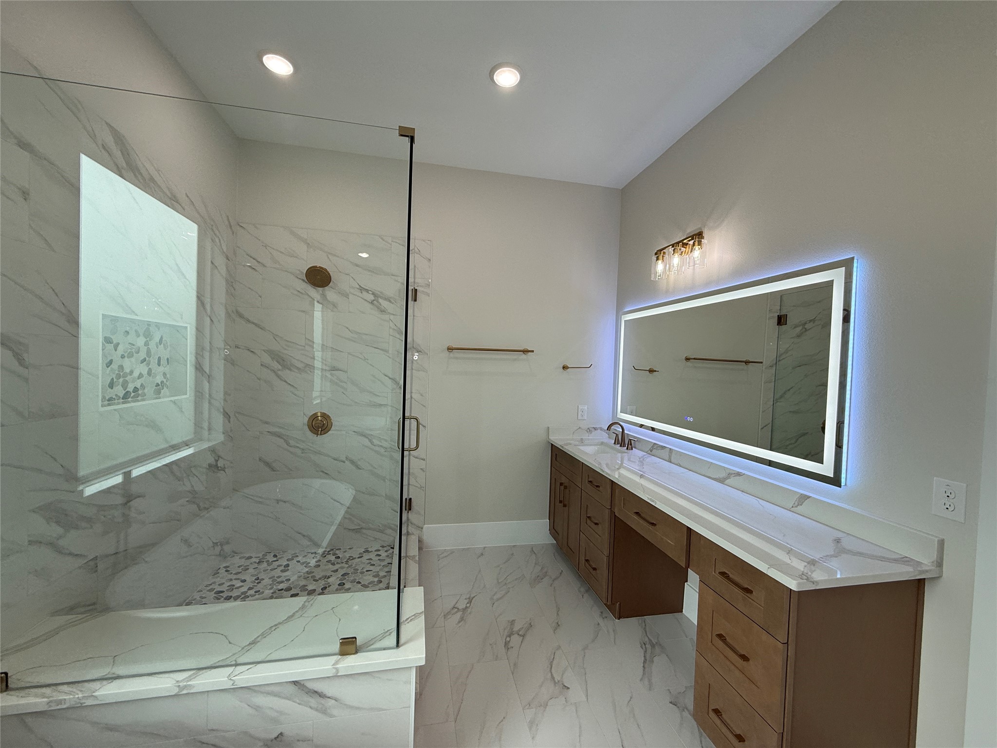 1214 Quarter Horse Trail Angleton, TX 77515 - Photo 19 of 32 a bathroom with a granite countertop sink a mirror and a shower