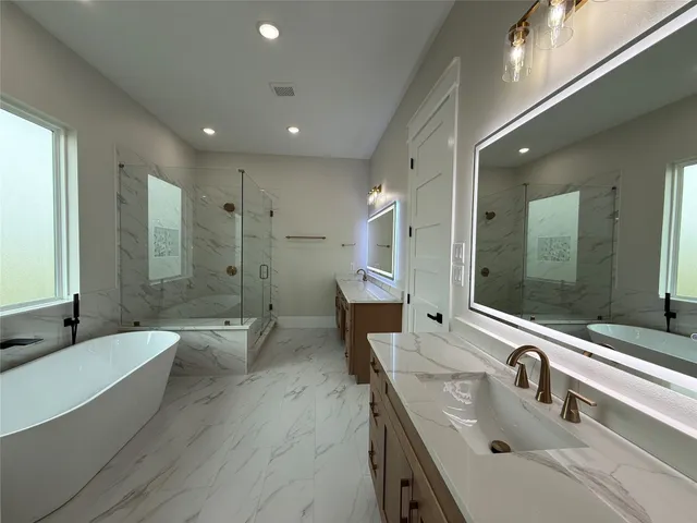 a kitchen with cabinets and wooden floor