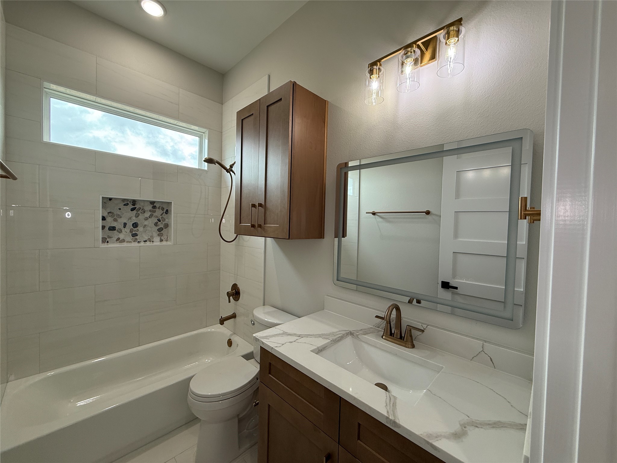 1214 Quarter Horse Trail Angleton, TX 77515 - Photo 24 of 32 a bathroom with a sink a toilet and shower