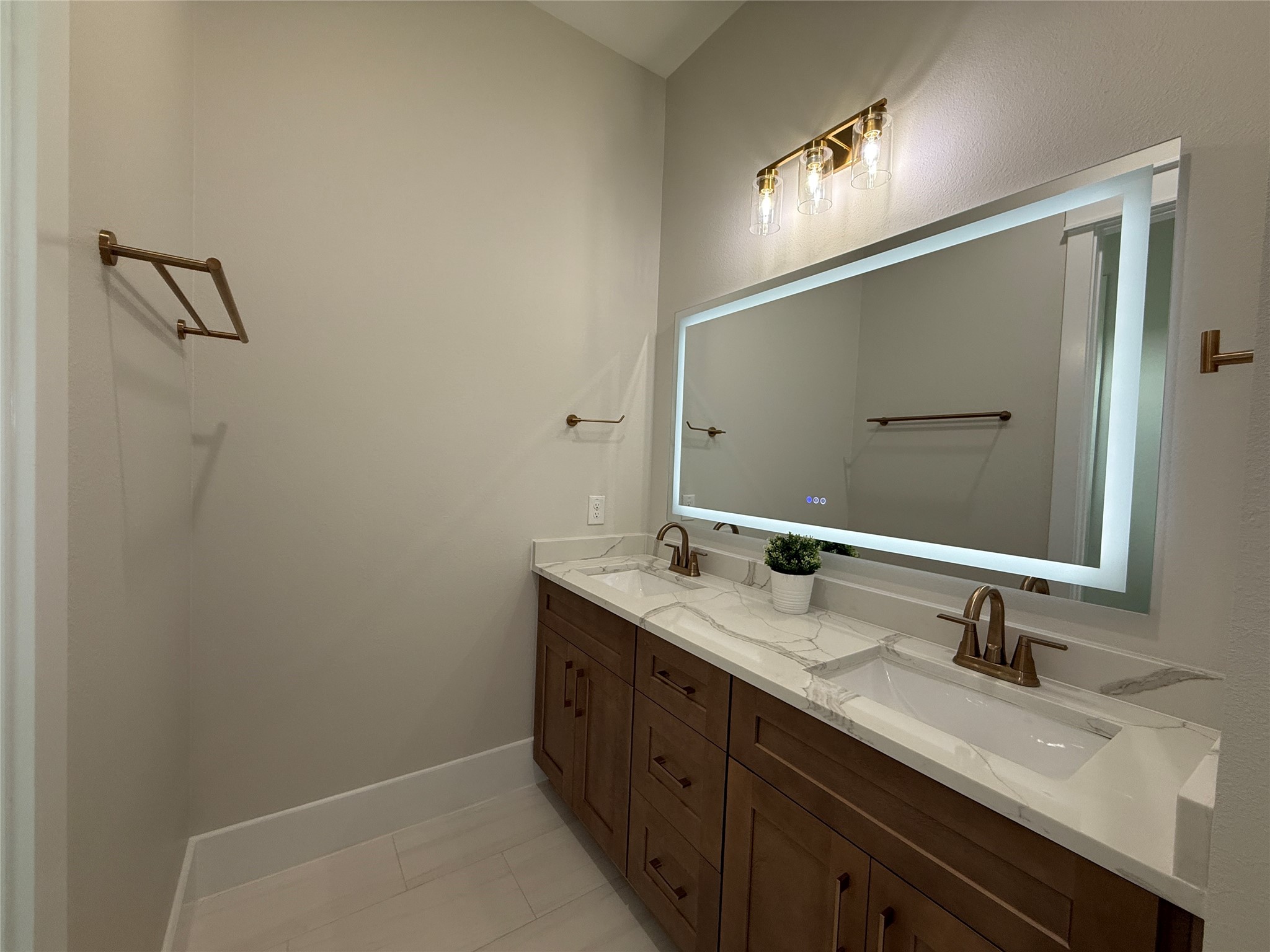 1214 Quarter Horse Trail Angleton, TX 77515 - Photo 26 of 32 a bathroom with a double vanity sink and a mirror