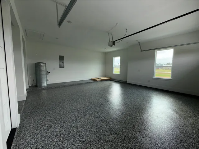 an aerial view of a house with yard