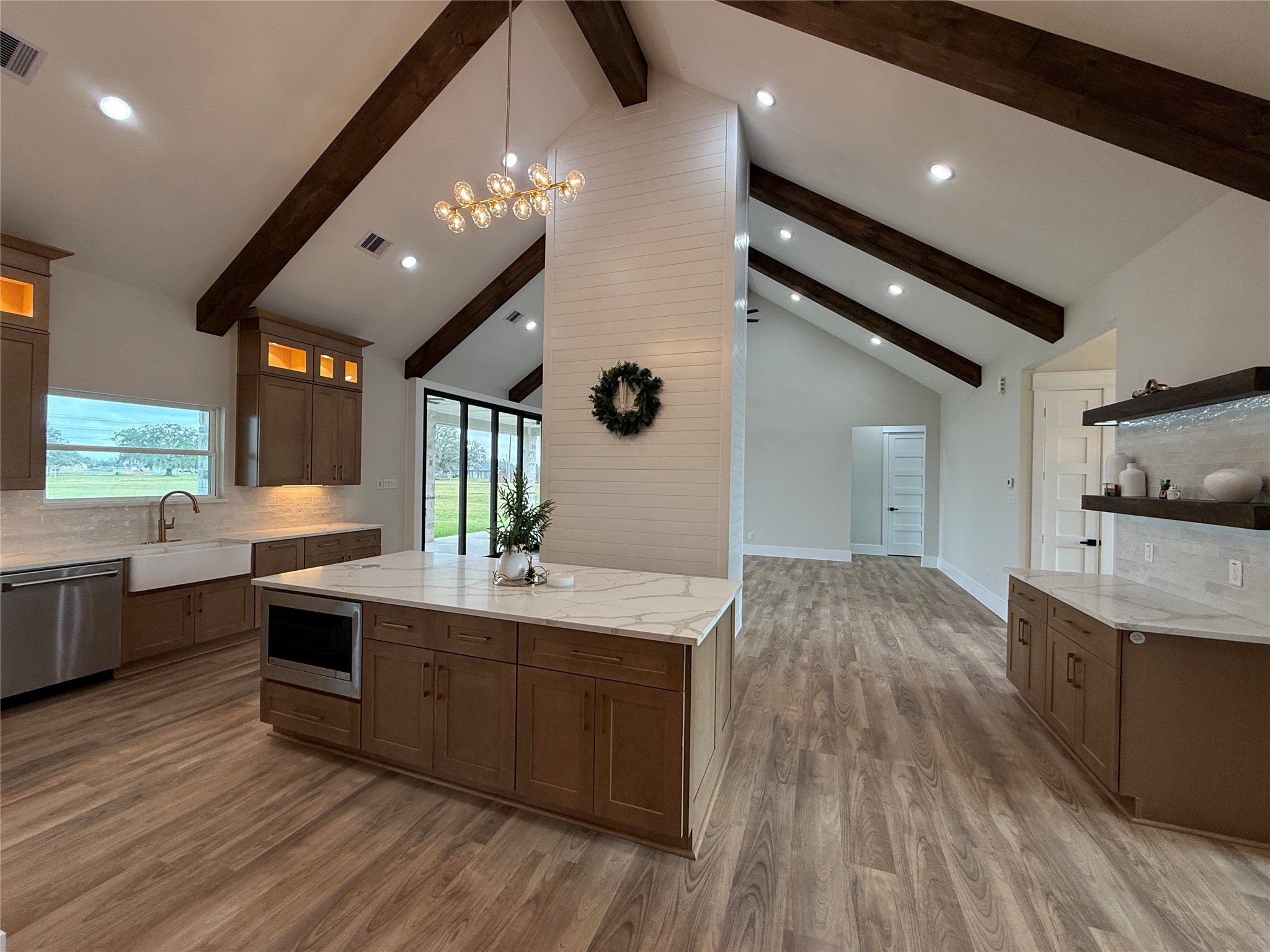 1214 Quarter Horse Trail Angleton, TX 77515 - Photo 10 of 32 a large kitchen with stainless steel appliances granite countertop a lot of counter space and wooden floors