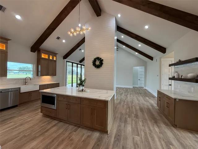 a kitchen with a sink and stove