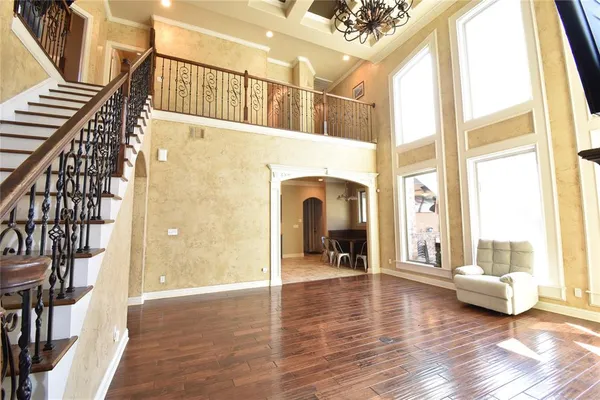 a view of an entryway with wooden floor and windows