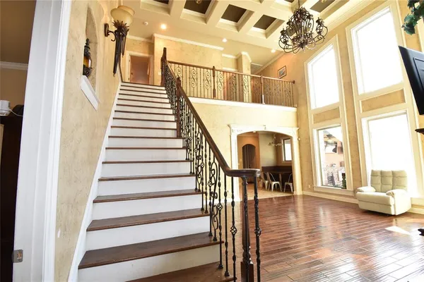 a view of an entryway with wooden floor and door