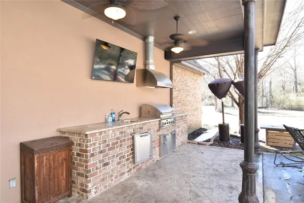 a view of living room with furniture and a large window
