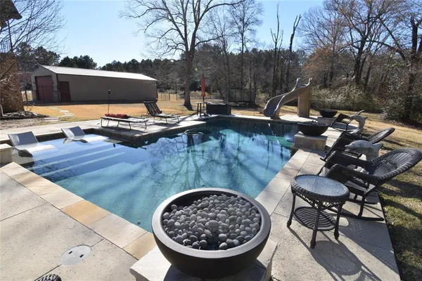 a view of a couches and dinning table in patio
