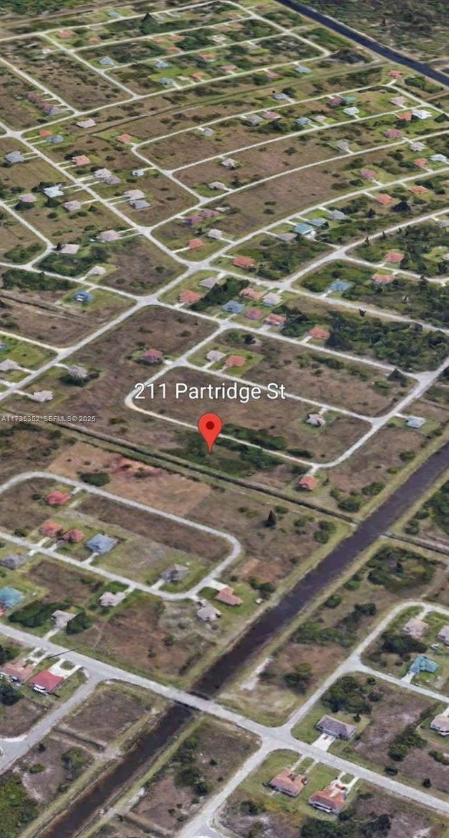 211 Partridge Street Lehigh Acres, FL 33974 - Photo 3 of 5 a view of a tennis court