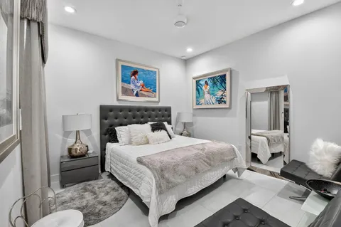 a bedroom with a large bed and a couch