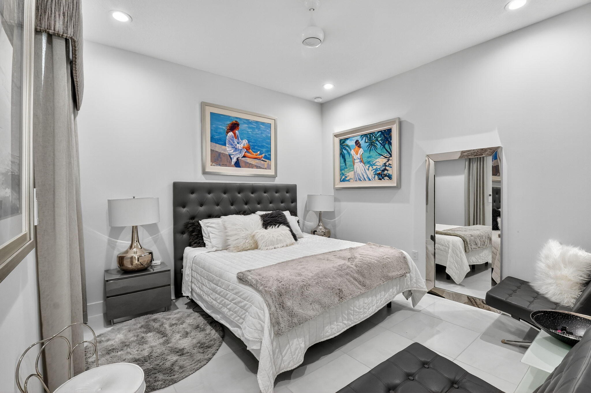 8331 Royal County Down Road Boca Raton, FL 33434 - Photo 17 of 30 a bedroom with a large bed and a couch