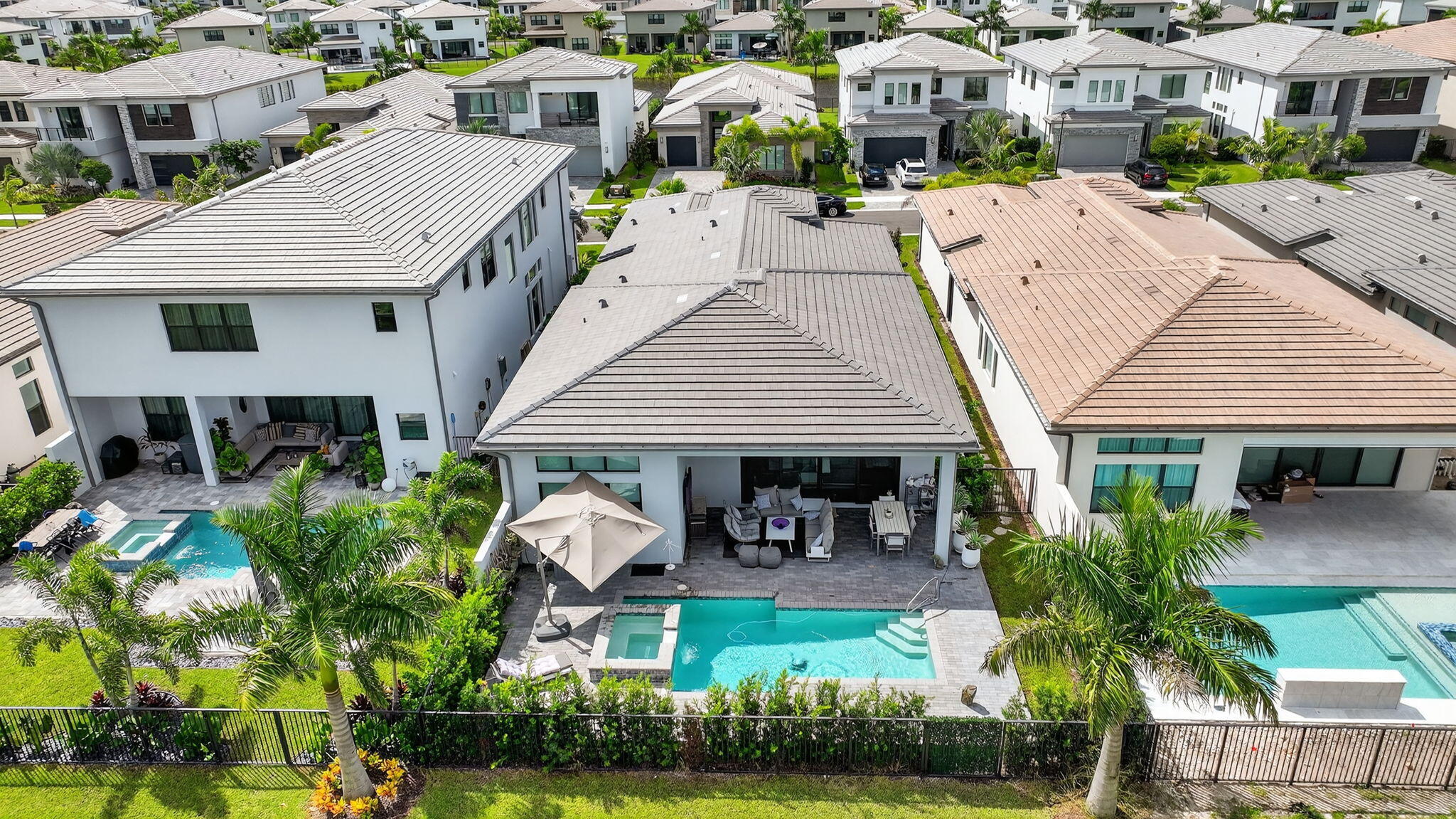 8331 Royal County Down Road Boca Raton, FL 33434 - Photo 27 of 30 a aerial view of a house with table and chairs in patio