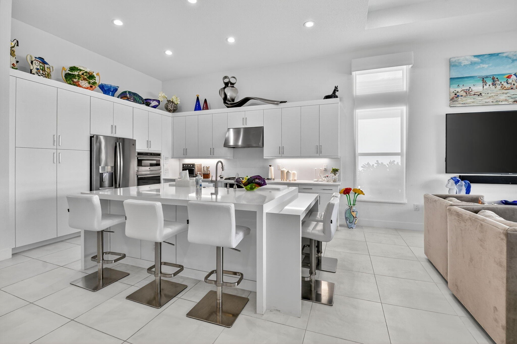 8331 Royal County Down Road Boca Raton, FL 33434 - Photo 4 of 30 a kitchen with stainless steel appliances kitchen island granite countertop a sink and cabinets