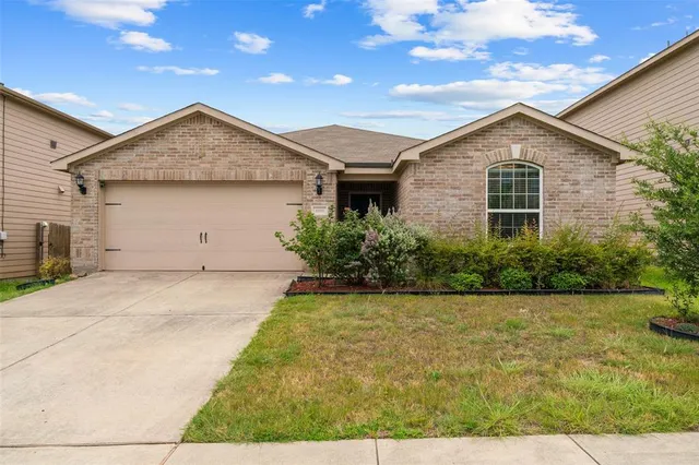 a view of a backyard of the house