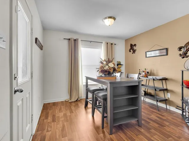 a kitchen with a stove a sink and cabinets