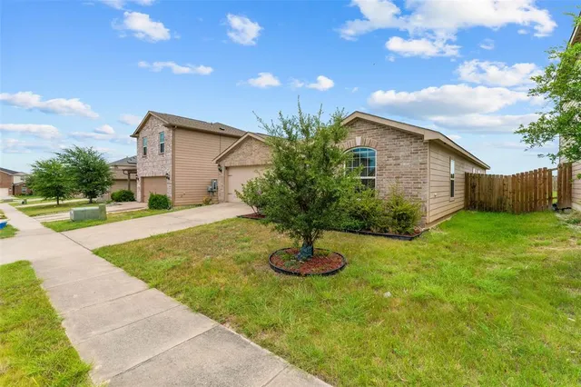 a house view with a garden space