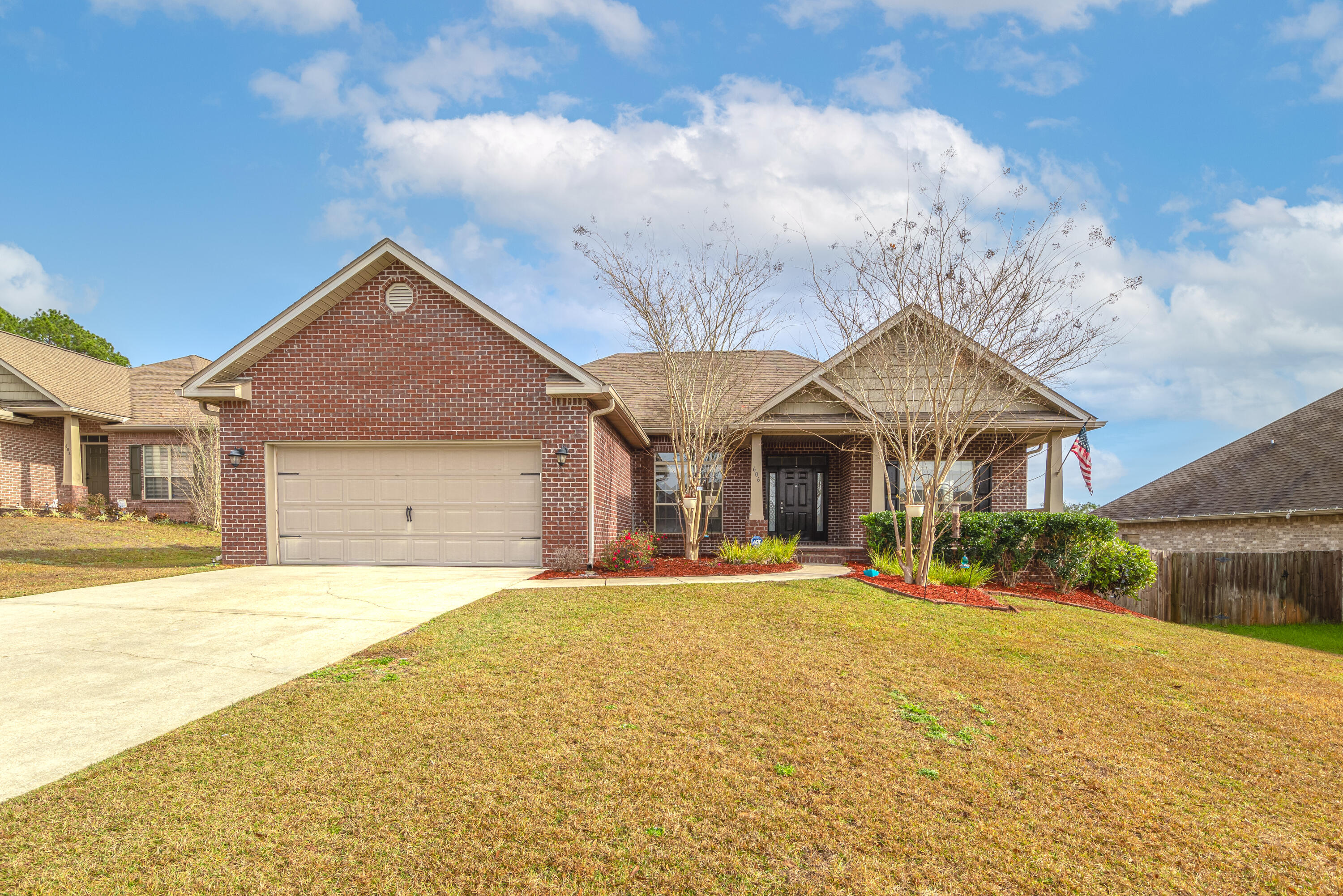 606 Rowan Circle Crestview, FL 32536 - Photo 1 of 24 a front view of a house with a yard
