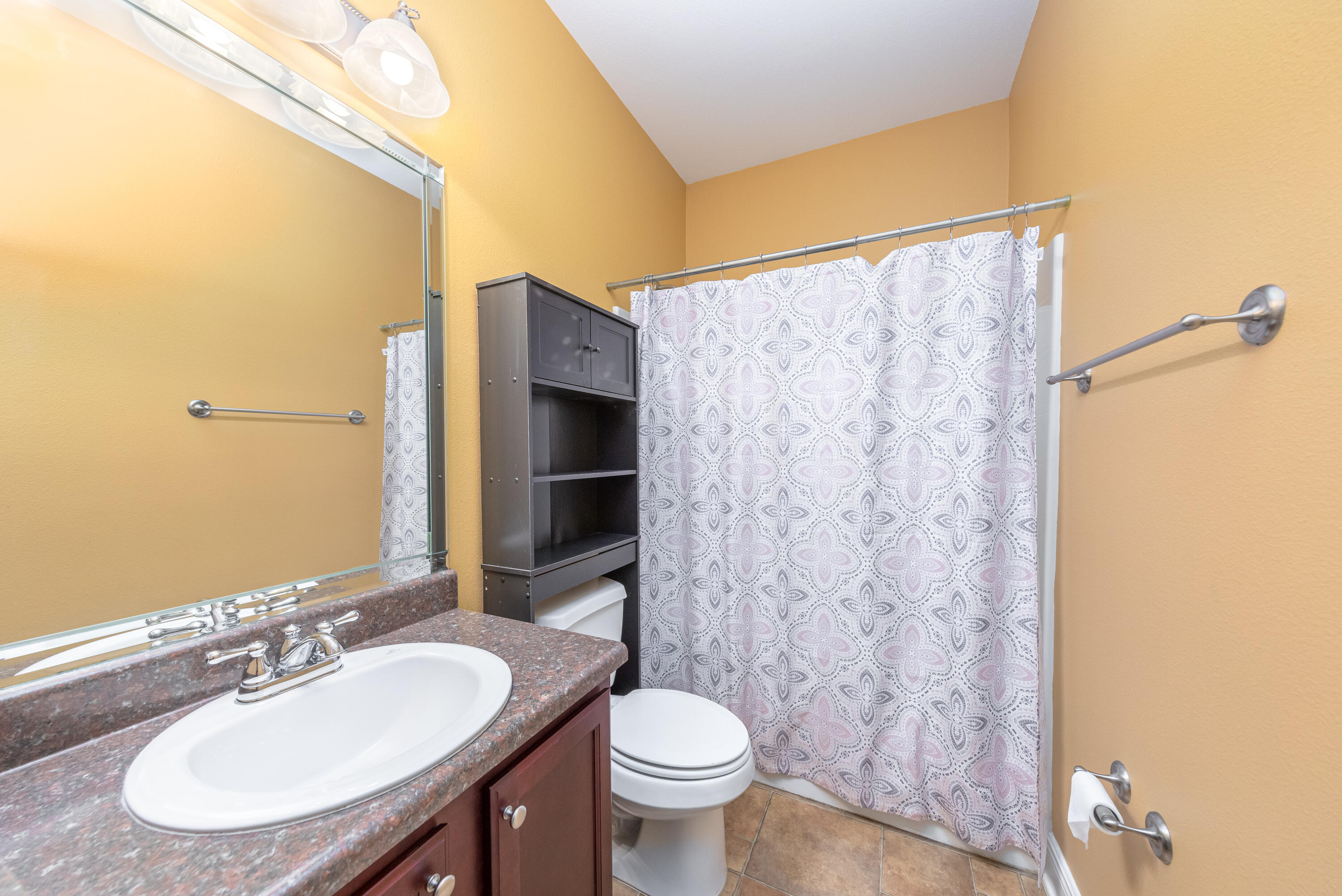 606 Rowan Circle Crestview, FL 32536 - Photo 12 of 24 a bathroom with a sink and a mirror