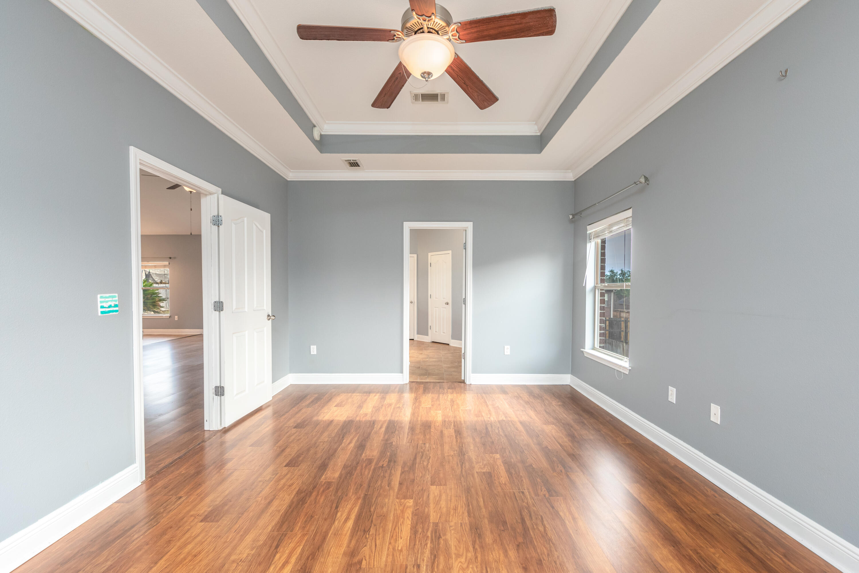 606 Rowan Circle Crestview, FL 32536 - Photo 17 of 24 a view of livingroom with window wooden floor and front door