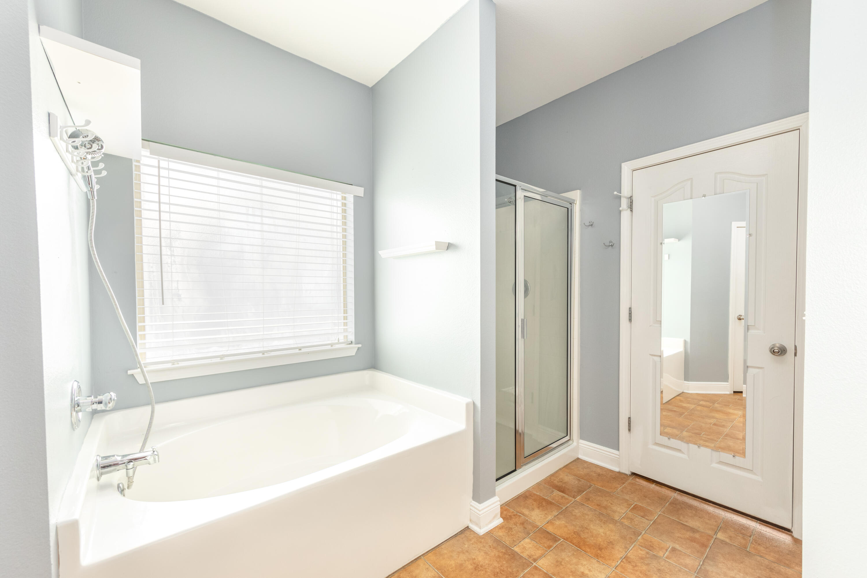 606 Rowan Circle Crestview, FL 32536 - Photo 19 of 24 a bathroom with a bathtub and shower