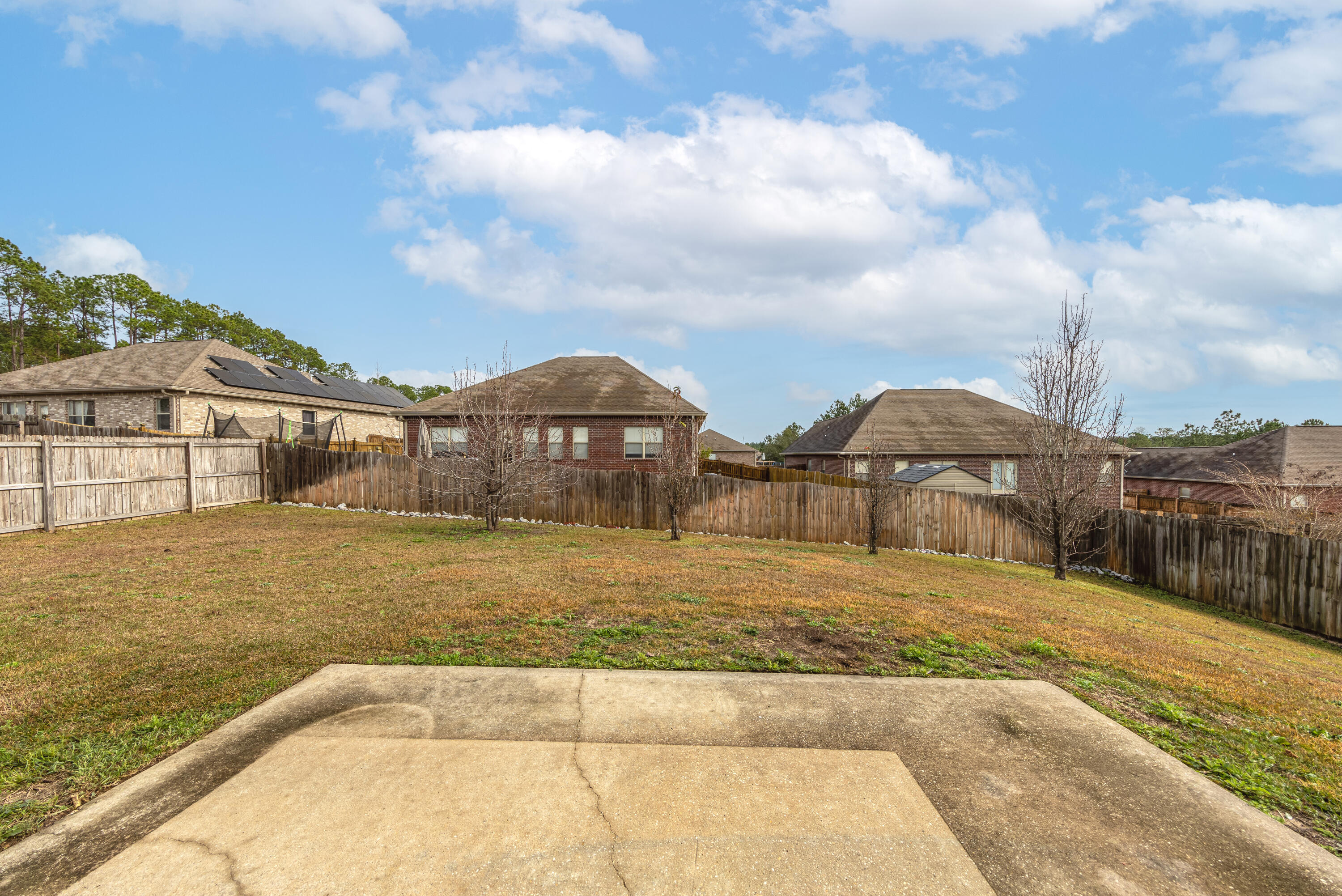 606 Rowan Circle Crestview, FL 32536 - Photo 21 of 24 a view of a house with basketball court