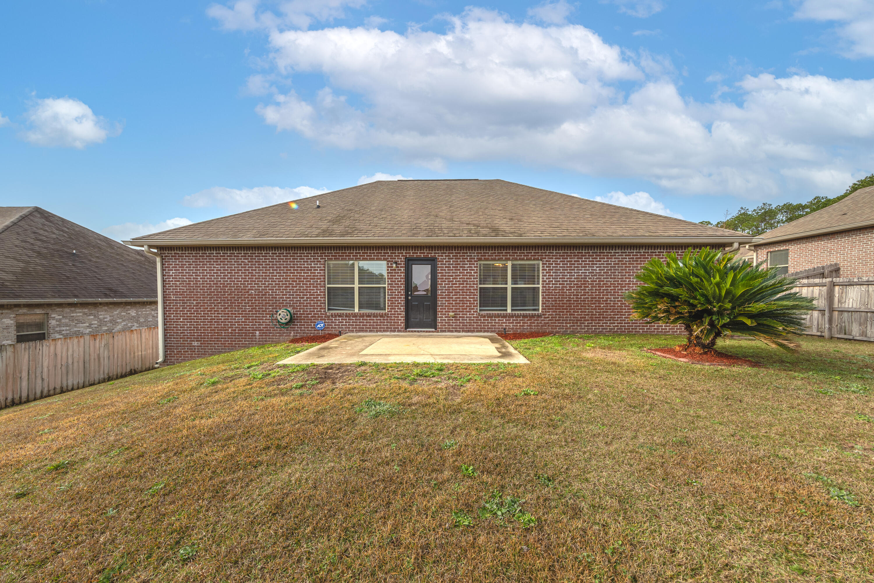 606 Rowan Circle Crestview, FL 32536 - Photo 22 of 24 a front view of house with yard and trees in the background