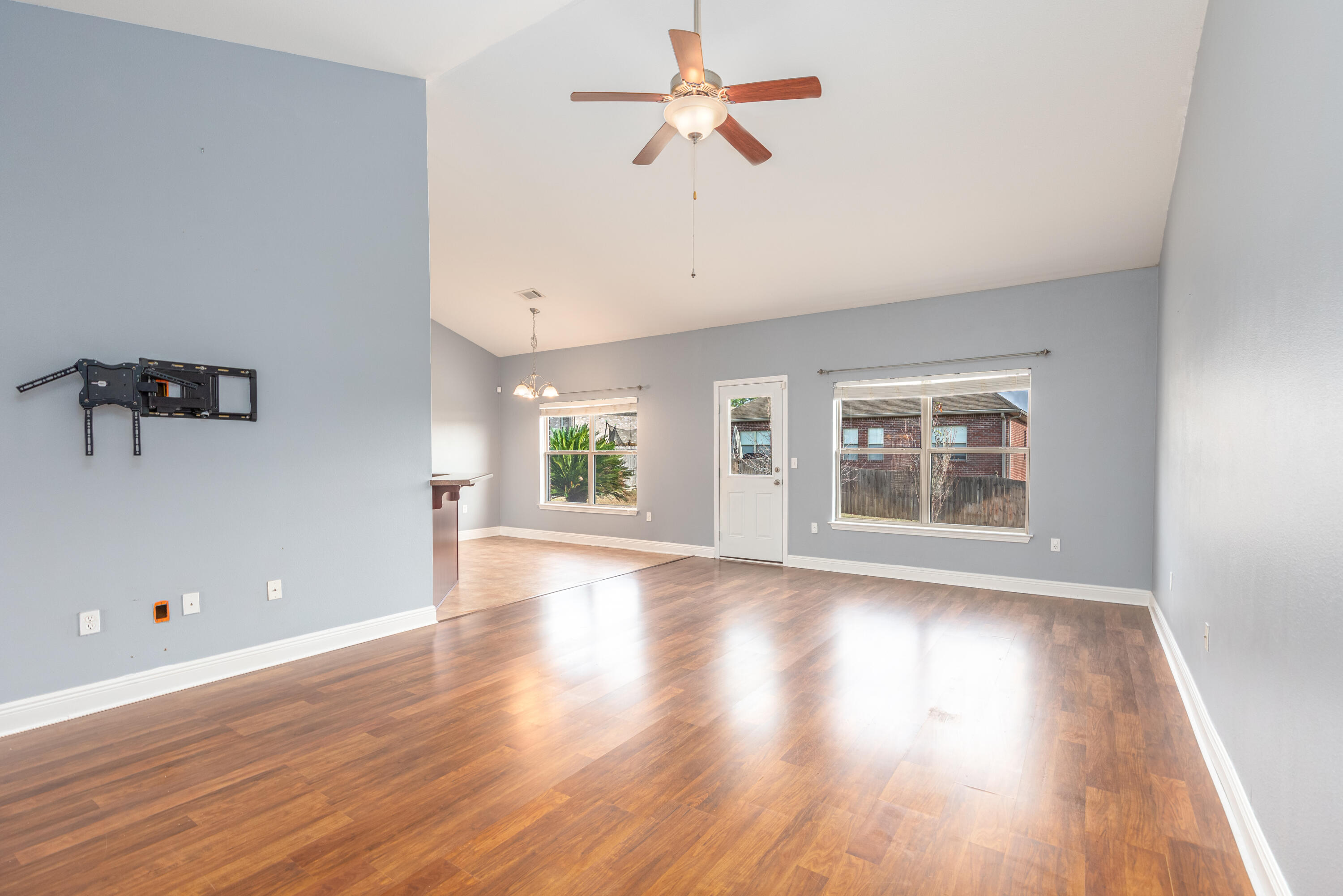 606 Rowan Circle Crestview, FL 32536 - Photo 3 of 24 wooden floor in an empty room with a window
