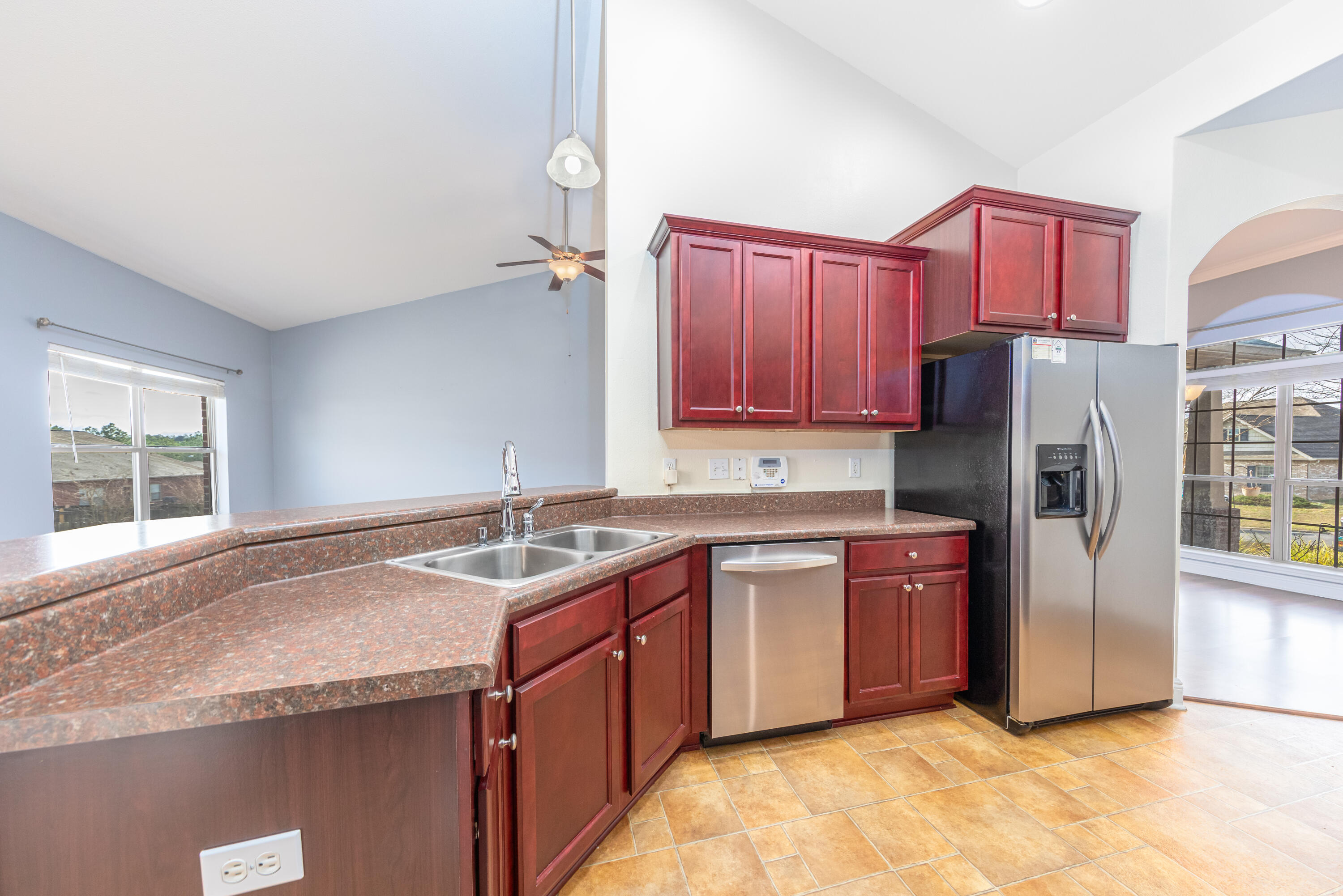 606 Rowan Circle Crestview, FL 32536 - Photo 5 of 24 a kitchen with stainless steel appliances granite countertop a sink dishwasher stove and refrigerator