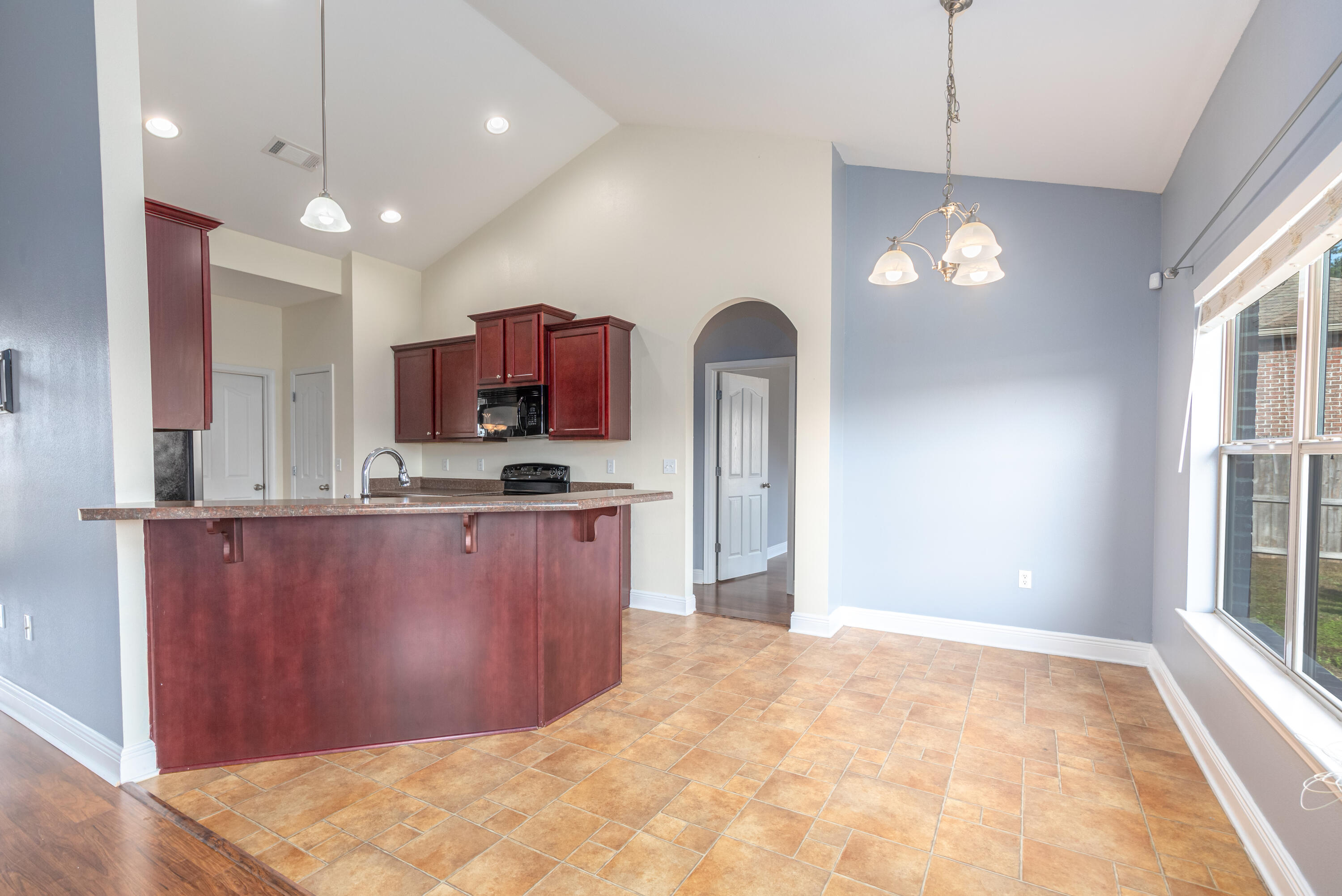 606 Rowan Circle Crestview, FL 32536 - Photo 9 of 24 a kitchen with stainless steel appliances granite countertop cabinets and refrigerator