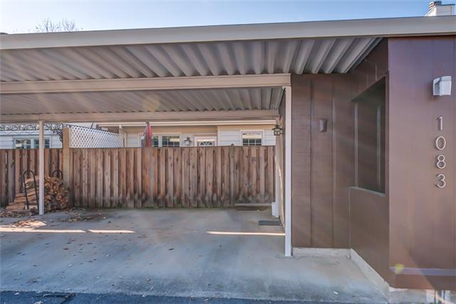 1083 General George Patton Road, Unit 1083 Nashville, TN 37221 - Photo 4 of 18 Carport for two cars. Covered trash area to the far right adjacent to locked storage area. Carports have been freshly painted in the neighborhood. Guest parking directly behind carport.
