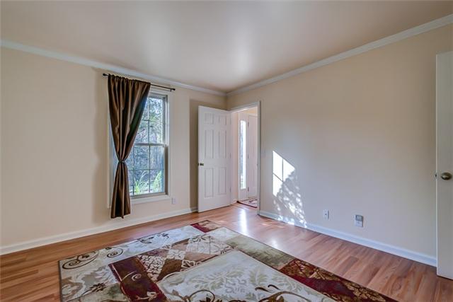1083 General George Patton Road, Unit 1083 Nashville, TN 37221 - Photo 9 of 18 Bedroom with full bath on Main level. Hardwood floor.