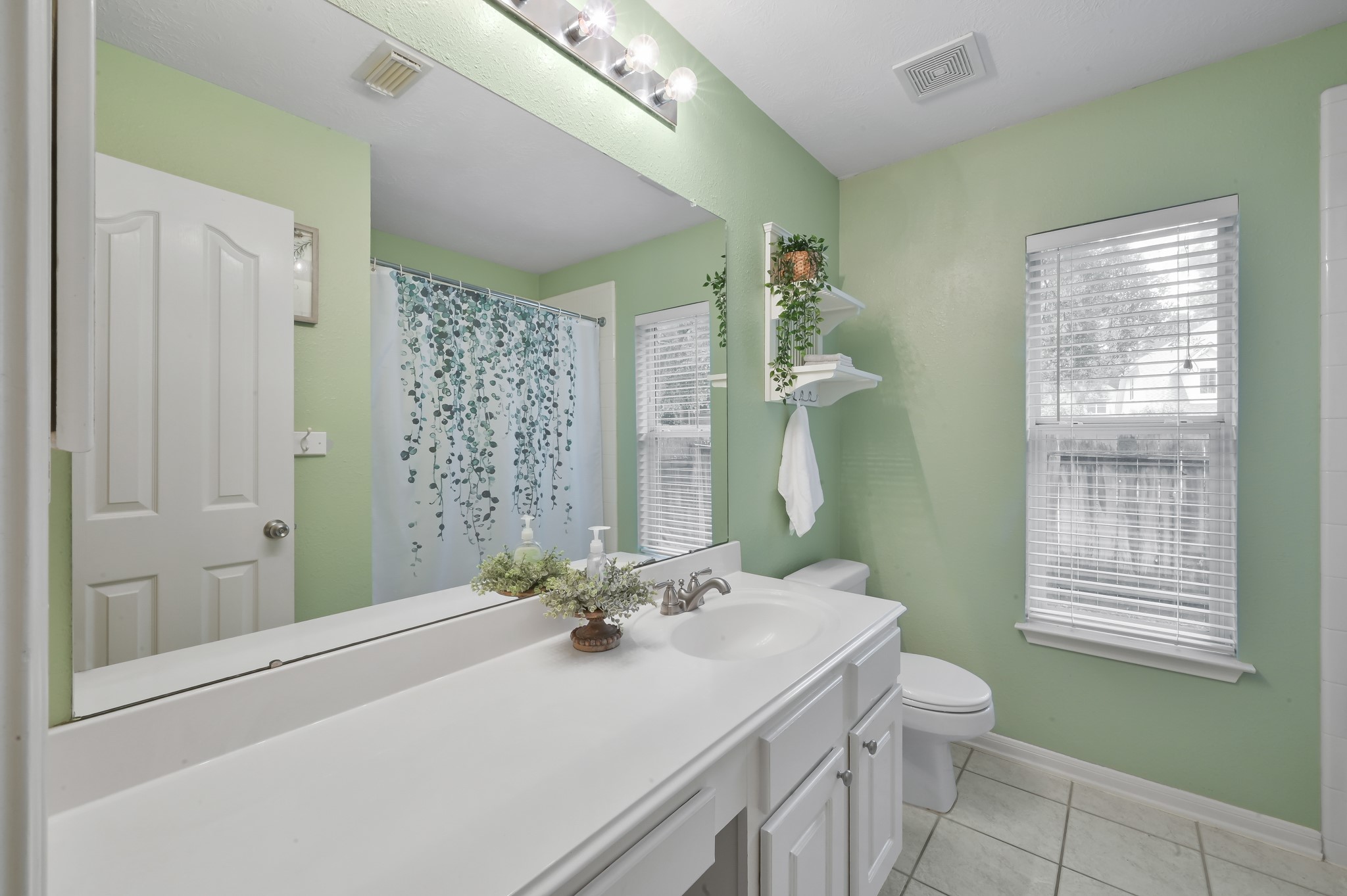 2 Westward Ridge Place The Woodlands, TX 77384 - Photo 29 of 43 Bathroom 2 features a tub/shower combination and a vanity. Plenty of counter space with drawers and seating space.