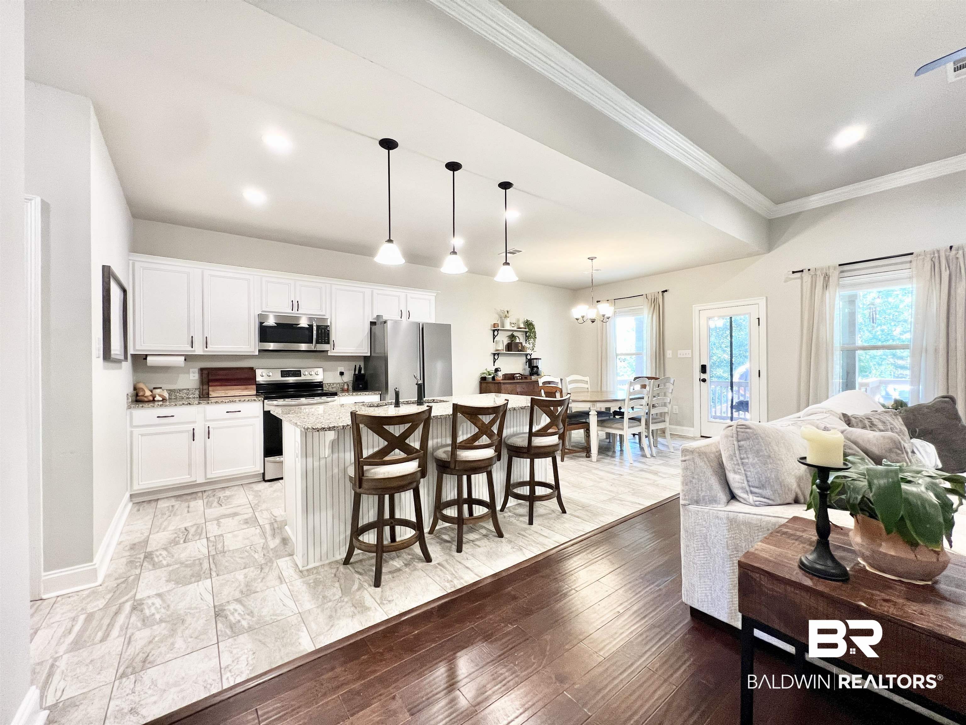 32290 Calder Court Daphne, AL 36527 - Photo 21 of 59 Kitchen featuring light hardwood / wood-style flooring, white cabinetry, stainless steel appliances, and plenty of natural light
