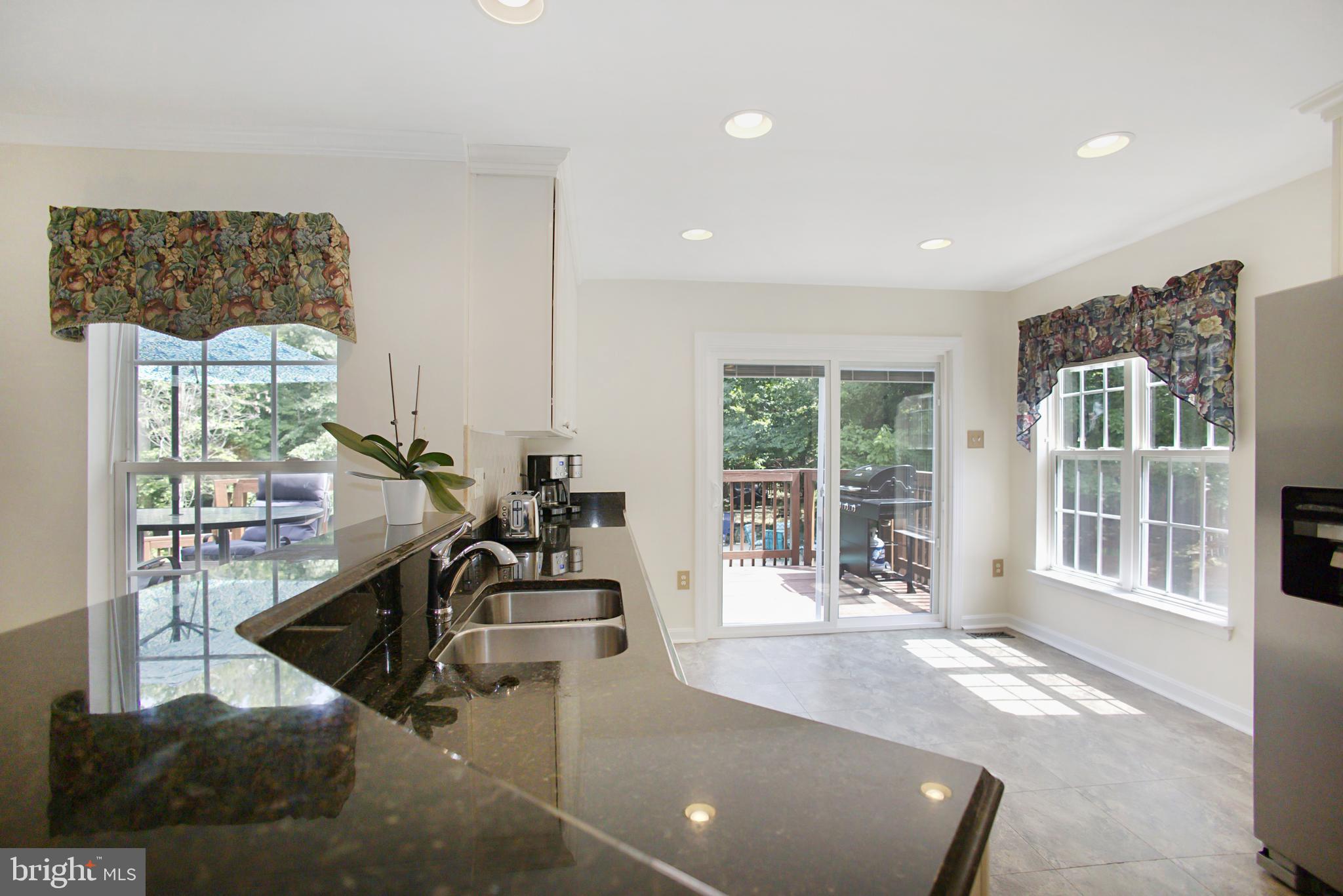6008 Sandy Ridge Elkridge, MD 21075 - Photo 5 of 31 Kitchen with sliding doors to deck
