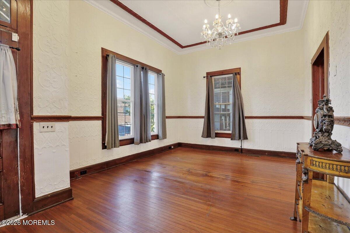 55 East Front Street Keyport, NJ 07735 - Photo 11 of 42 a view of an empty room with window and wooden floor