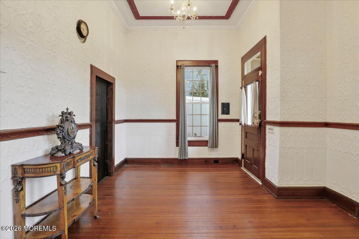 55 East Front Street Keyport, NJ 07735 - Photo 12 of 42 a view of a livingroom with wooden floor and a staircase