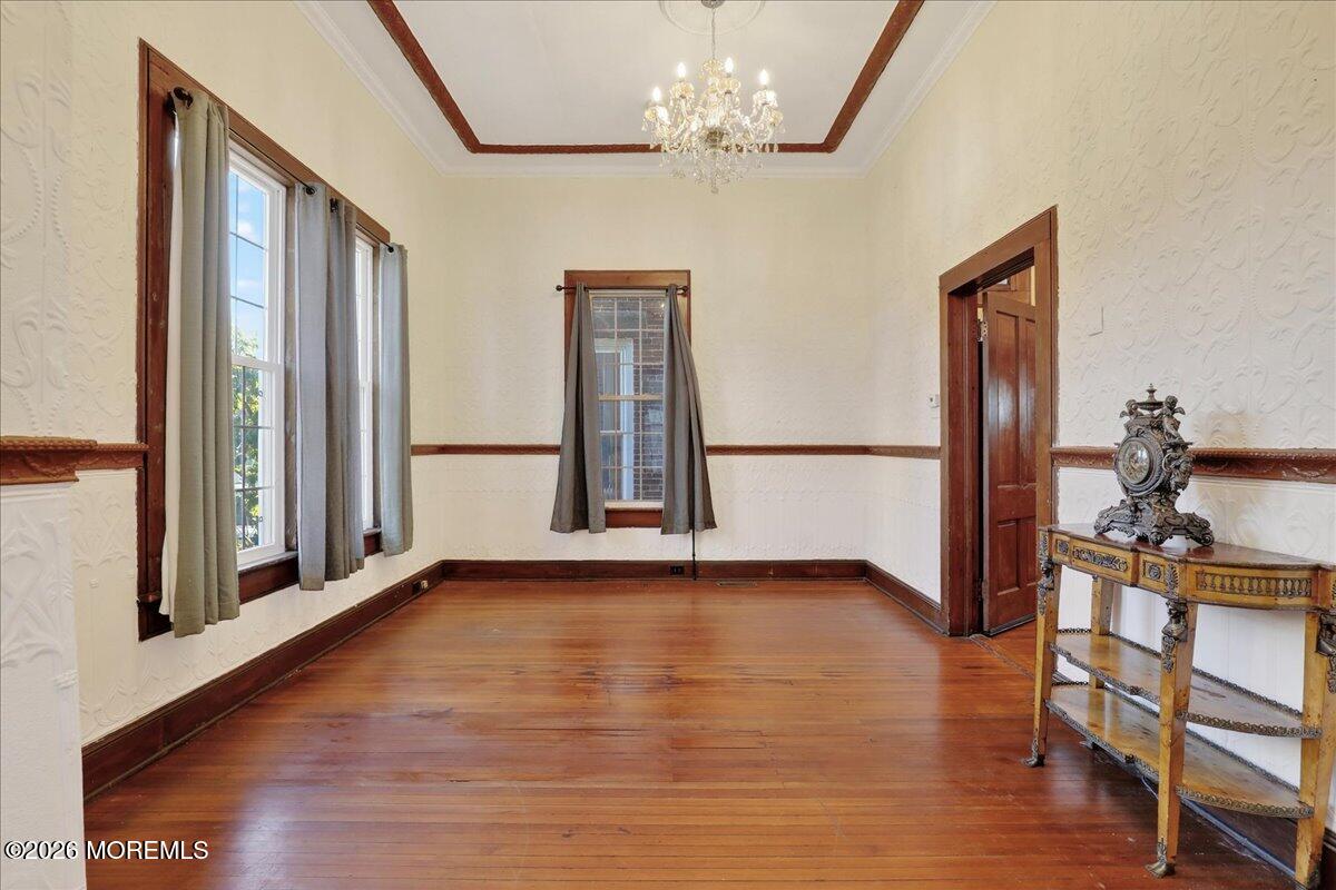 55 East Front Street Keyport, NJ 07735 - Photo 14 of 42 a view of a livingroom with wooden floor and a chandelier