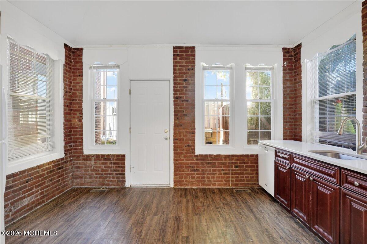 55 East Front Street Keyport, NJ 07735 - Photo 23 of 42 a room with stairs and wooden floor