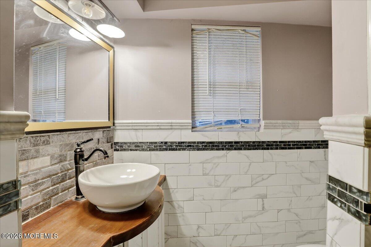 55 East Front Street Keyport, NJ 07735 - Photo 27 of 42 a bathroom with a sink and a mirror