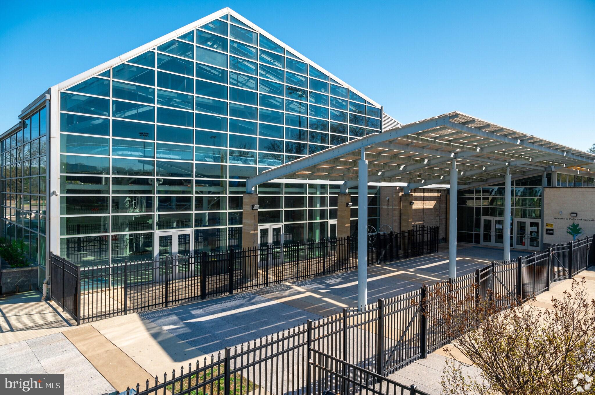 4419 Foote Street Northeast Washington, DC 20019 - Photo 11 of 13 a view of house with a large window and potted plants