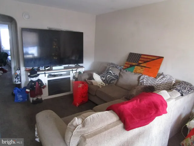 a room with furniture and musical instruments