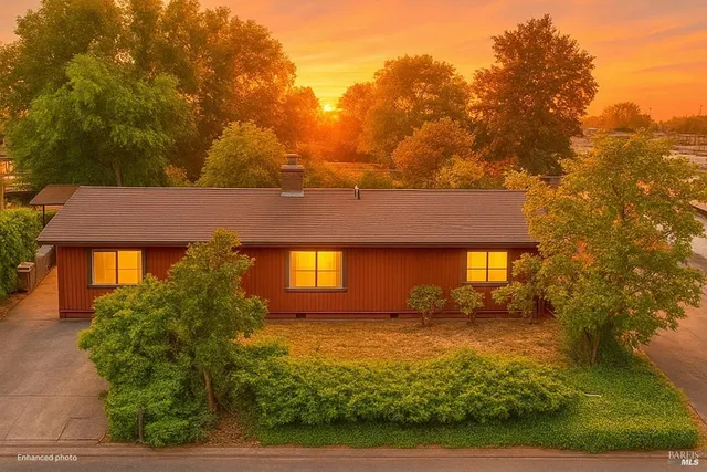 front view of house next to a yard