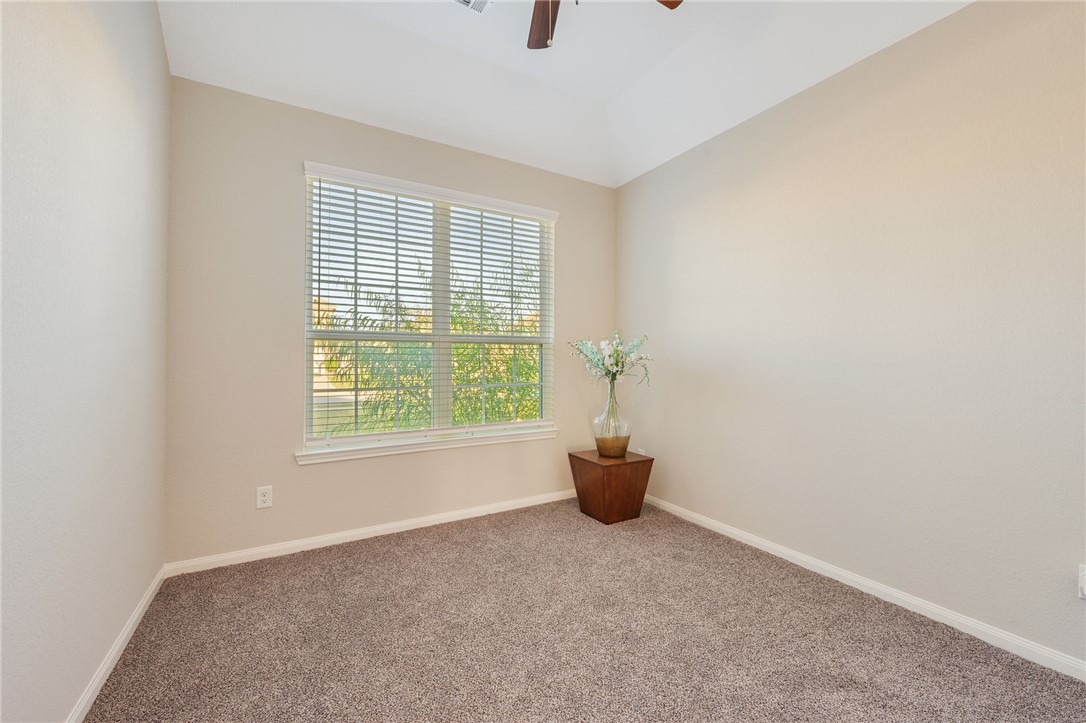 4704 Los Pines Way Bryan, TX 77807 - Photo 18 of 26 an empty room with windows