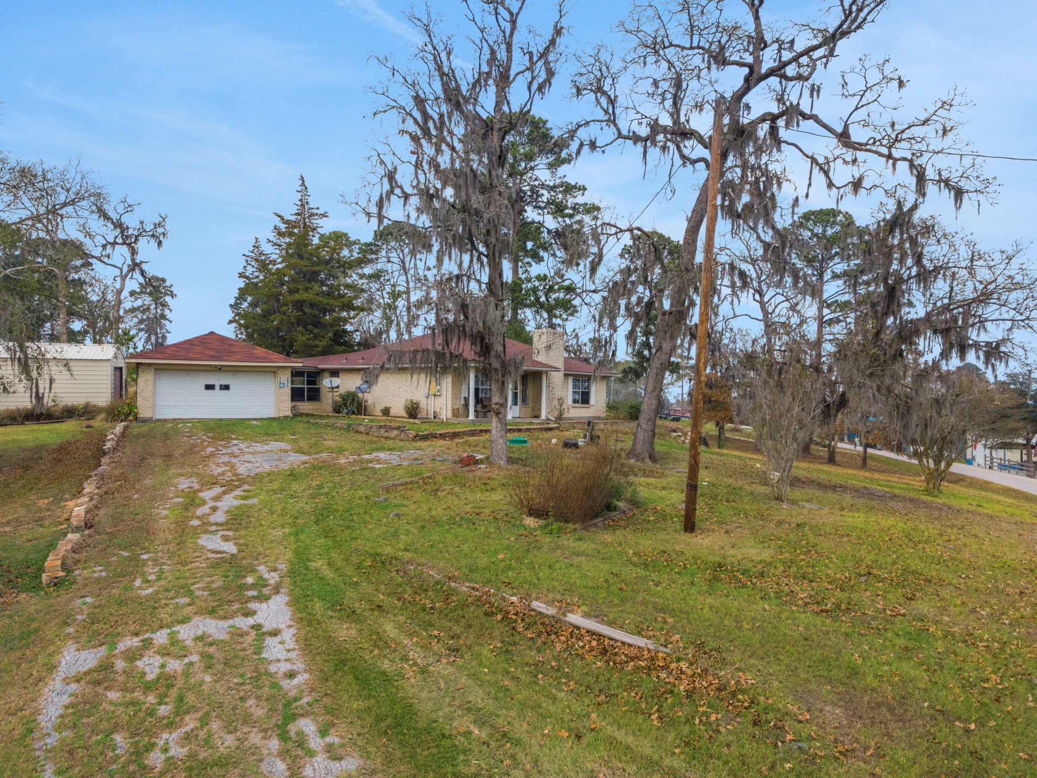 61 Campfire Circle Coldspring, TX 77331 - Photo 25 of 30 a view of a house with a yard