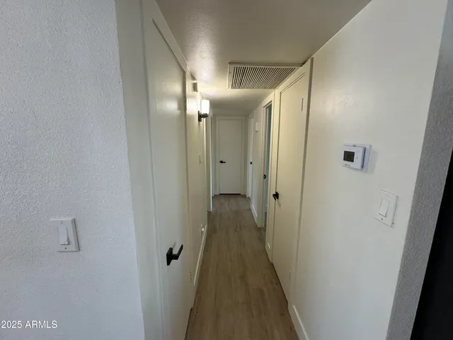 a view of a bathroom from the hallway