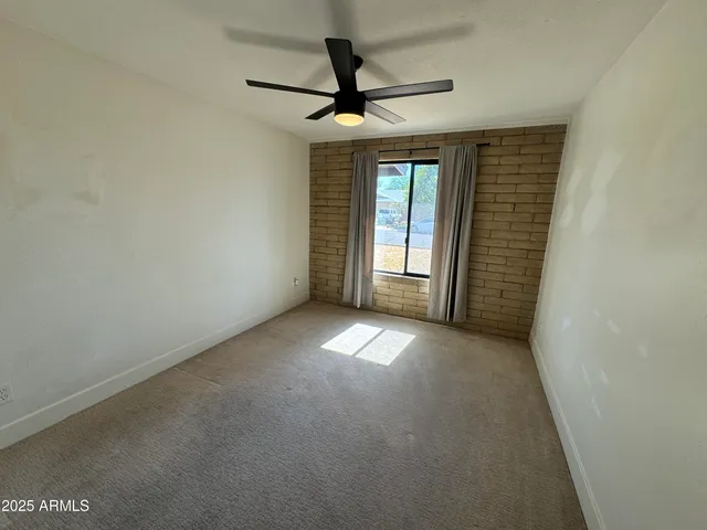 a view of empty room with windows