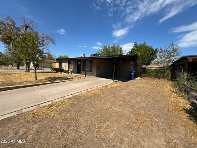 a view of a backyard of the house