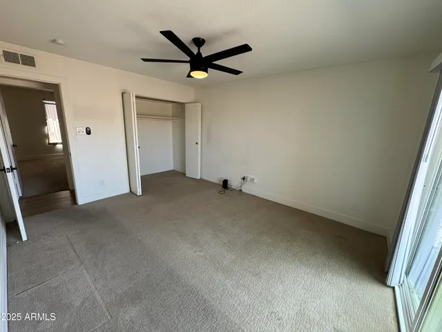 a view of a livingroom with a ceiling fan