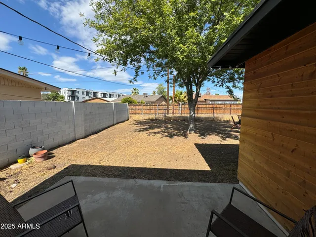 a view of a backyard of the house